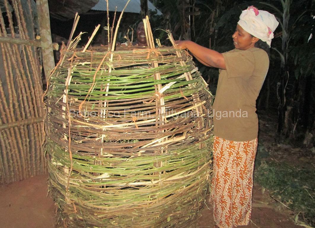 A woman constructing a food granary